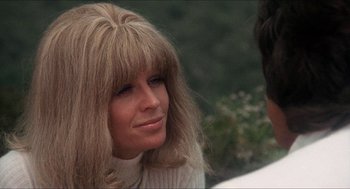 Movie still from “Shampoo” (1975), directed by Hal Ashby – A person wearing a sweater; Close Up shot, Over the shoulder angle