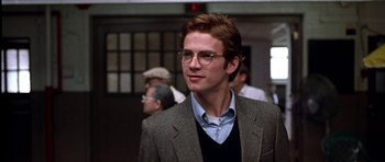 Movie still from “Shattered Glass” (2003), directed by Billy Ray – A man in a suit and glasses is looking to his left; Close Up shot, Over the shoulder angle