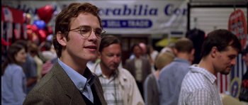Movie still from “Shattered Glass” (2003), directed by Billy Ray – A man standing in front of a crowd; Close Up shot, Low angle