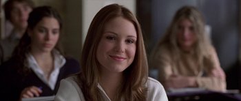 Movie still from “Shattered Glass” (2003), directed by Billy Ray – A person with long brown hair; Close Up shot, Over the shoulder angle