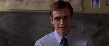 Movie still from “Shattered Glass” (2003), directed by Billy Ray – A man wearing glasses and a shirt and tie; Close Up shot, Over the shoulder angle