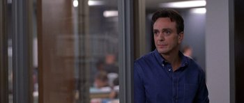 Movie still from “Shattered Glass” (2003), directed by Billy Ray – A man standing in front of a window; Close Up shot, Over the shoulder angle