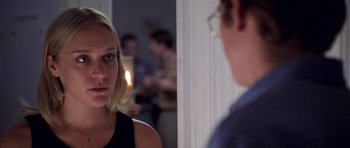 Movie still from “Shattered Glass” (2003), directed by Billy Ray – A woman looking at a man in a room; Close Up shot, Over the shoulder angle
