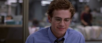 Movie still from “Shattered Glass” (2003), directed by Billy Ray – A young man wearing a blue shirt and tie; Close Up shot, Over the shoulder angle