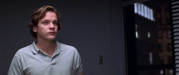 Movie still from “Shattered Glass” (2003), directed by Billy Ray – A man standing in front of a wall; Close Up shot, Low angle