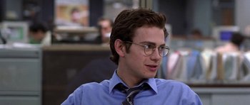 Movie still from “Shattered Glass” (2003), directed by Billy Ray – A young man wearing a blue shirt and a tie; Close Up shot, Over the shoulder angle