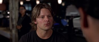 Movie still from “Shattered Glass” (2003), directed by Billy Ray – A person with long hair; Close Up shot, Over the shoulder angle