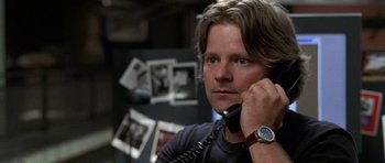 Movie still from “Shattered Glass” (2003), directed by Billy Ray – A man holding a phone up to his ear; Close Up shot, Over the shoulder angle