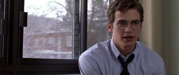 Movie still from “Shattered Glass” (2003), directed by Billy Ray – A young man wearing glasses and a shirt and tie; Close Up shot, Over the shoulder angle