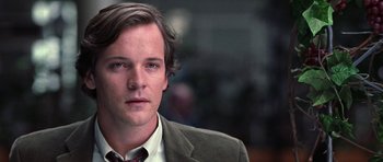 Movie still from “Shattered Glass” (2003), directed by Billy Ray – A person wearing a suit and tie; Close Up shot, Low angle