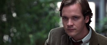 Movie still from “Shattered Glass” (2003), directed by Billy Ray – A person wearing a jacket; Close Up shot, Over the shoulder angle