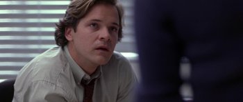 Movie still from “Shattered Glass” (2003), directed by Billy Ray – A person wearing a shirt and a tie; Close Up shot, Over the shoulder angle