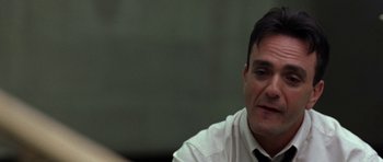 Movie still from “Shattered Glass” (2003), directed by Billy Ray – A person wearing a shirt and a tie; Close Up shot, Over the shoulder angle