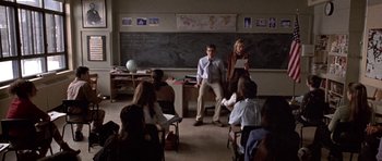 Movie still from “Shattered Glass” (2003), directed by Billy Ray – A group of people sitting in a classroom; Wide shot, High angle