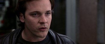 Movie still from “Shattered Glass” (2003), directed by Billy Ray – A person wearing a leather jacket; Close Up shot, Low angle