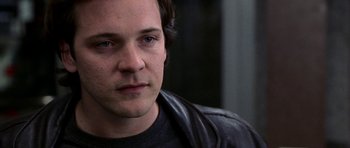 Movie still from “Shattered Glass” (2003), directed by Billy Ray – A person wearing a leather jacket; Close Up shot, Over the shoulder angle