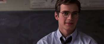 Movie still from “Shattered Glass” (2003), directed by Billy Ray – A young man wearing glasses and wearing a tie; Close Up shot, Over the shoulder angle