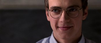 Movie still from “Shattered Glass” (2003), directed by Billy Ray – A person wearing glasses; Close Up shot, Over the shoulder angle