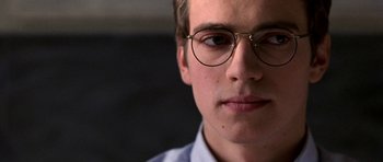 Movie still from “Shattered Glass” (2003), directed by Billy Ray – A person wearing glasses; Close Up shot, Over the shoulder angle