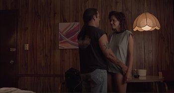 Movie still from “Sherrybaby” (2006), directed by Laurie Collyer – A man and a woman standing next to each other in a room; Medium shot, High angle