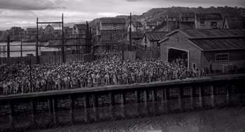 Movie still from “Ship of Fools” (1965), directed by Stanley Kramer – A black - and - white photo of a crowd of people; Extreme Wide shot, High angle
