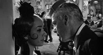 Movie still from “Ship of Fools” (1965), directed by Stanley Kramer – A man and a woman are looking into each others eyes; Close Up shot, Over the shoulder angle