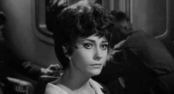 Movie still from “Ship of Fools” (1965), directed by Stanley Kramer – A black - and - white photo of a woman in a white dress; Close Up shot, High angle