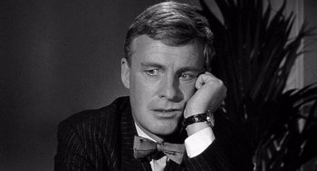 Movie still from “Ship of Fools” (1965), directed by Stanley Kramer – Black and white photograph of a man wearing a bow tie; Close Up shot, Low angle