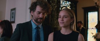 A man and a woman standing next to each other