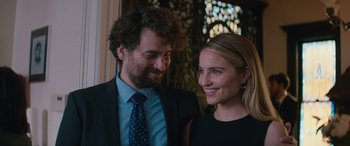 A man and a woman smiling for the camera