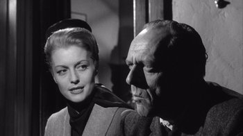 Movie still from “Shock Corridor” (1963), directed by Samuel Fuller – A man and a woman standing next to each other; Close Up shot, Low angle