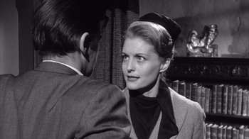 Movie still from “Shock Corridor” (1963), directed by Samuel Fuller – A man and a woman are standing next to each other; Close Up shot, Low angle