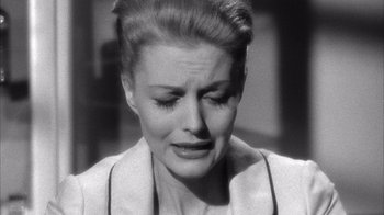 Movie still from “Shock Corridor” (1963), directed by Samuel Fuller – An old black and white photo of a woman crying; Close Up shot, High angle