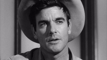 Movie still from “Shock Corridor” (1963), directed by Samuel Fuller – Black and white photograph of a man wearing a cowboy hat; Close Up shot, Low angle