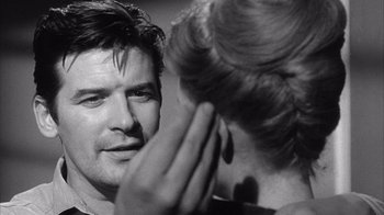 Movie still from “Shock Corridor” (1963), directed by Samuel Fuller – A black and white photo of a man and a woman; Close Up shot, Over the shoulder angle