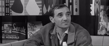 Movie still from “Shoot the Piano Player” (1960), directed by François Truffaut – Black and white photograph of a man in a jacket; Close Up shot, High angle