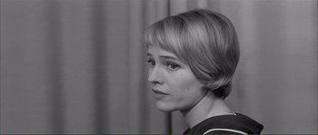 Movie still from “Shoot the Piano Player” (1960), directed by François Truffaut – Black and white photograph of a woman with short blonde hair; Close Up shot, Over the shoulder angle