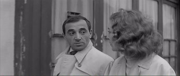 Movie still from “Shoot the Piano Player” (1960), directed by François Truffaut – A man and a woman standing next to each other; Close Up shot, Over the shoulder angle