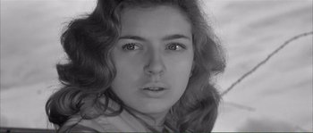 Movie still from “Shoot the Piano Player” (1960), directed by François Truffaut – A black - and - white photo of a young woman's face; Close Up shot, High angle