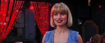 Movie still from “Showgirls” (1995), directed by Paul Verhoeven – A person wearing a blue shirt; Close Up shot, Over the shoulder angle