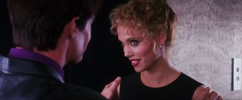 Movie still from “Showgirls” (1995), directed by Paul Verhoeven – A man and a woman talking to each other; Close Up shot, Over the shoulder angle