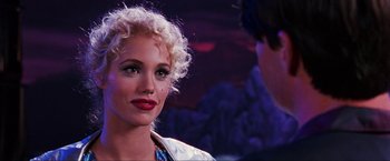 Movie still from “Showgirls” (1995), directed by Paul Verhoeven – A person wearing a white shirt; Close Up shot, Over the shoulder angle