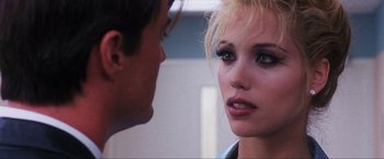 Movie still from “Showgirls” (1995), directed by Paul Verhoeven – A man and a woman face to face in a room; Close Up shot, Over the shoulder angle