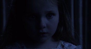 Movie still from “Signs” (2002), directed by M. Night Shyamalan – A little girl is looking into the camera; Close Up shot, High angle