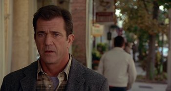 Movie still from “Signs” (2002), directed by M. Night Shyamalan – A person wearing a jacket; Close Up shot, Over the shoulder angle