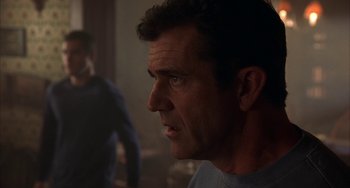 Movie still from “Signs” (2002), directed by M. Night Shyamalan – A person looking at the camera; Close Up shot, Over the shoulder angle