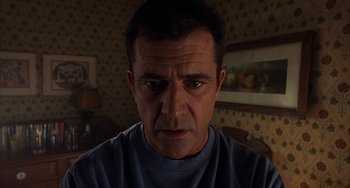 Movie still from “Signs” (2002), directed by M. Night Shyamalan – A person looking at the camera; Close Up shot, Low angle