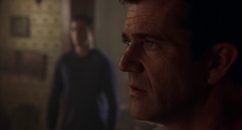 Movie still from “Signs” (2002), directed by M. Night Shyamalan – A person looking at the camera; Close Up shot, Over the shoulder angle