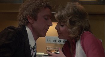Movie still from “Silver Streak” (1976), directed by Arthur Hiller – A man and a woman are looking at each other; Close Up shot, Over the shoulder angle