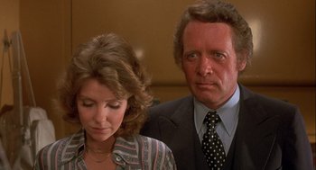 Movie still from “Silver Streak” (1976), directed by Arthur Hiller – A man and a woman standing next to each other; Close Up shot, Low angle